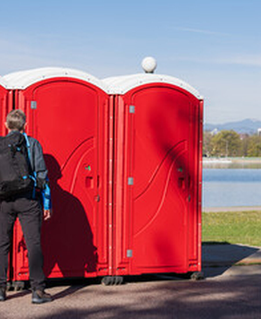 Portable restrooms set up at a public park event near Buena Park